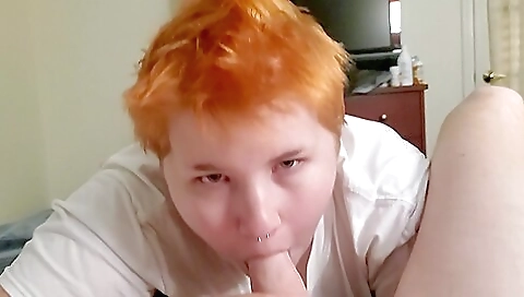 Redhead with tattooed pussy sucks and gets a handjob