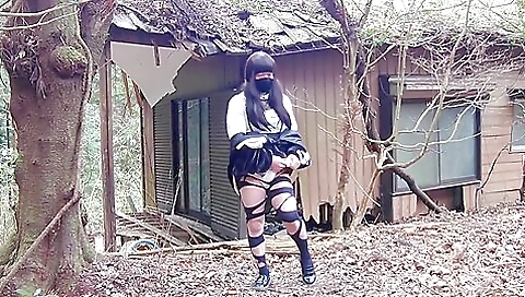 Brunette in stockings masturbates in an abandoned house