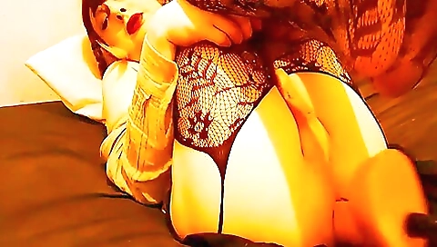 Brunette takes a dildo in her mouth to fuck herself